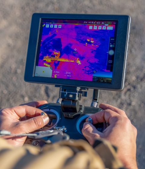 A drone using thermal imaging to inspect power lines.